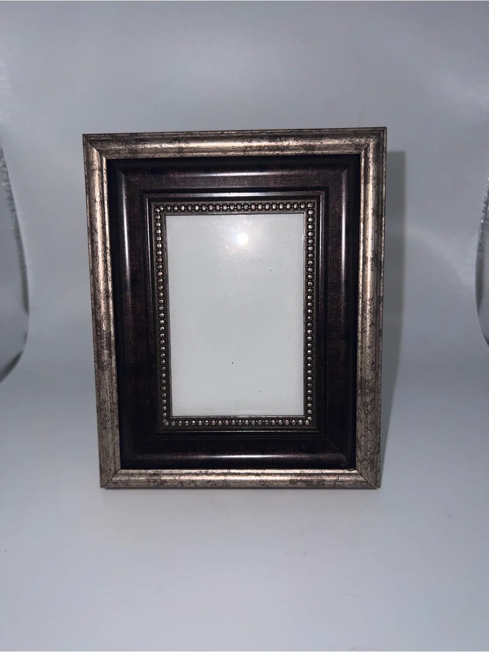 Traditional tabletop frame featuring an antique-inspired multi-layered design